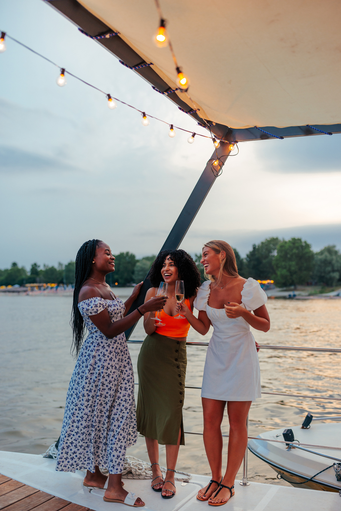 Happy young girls party on boat