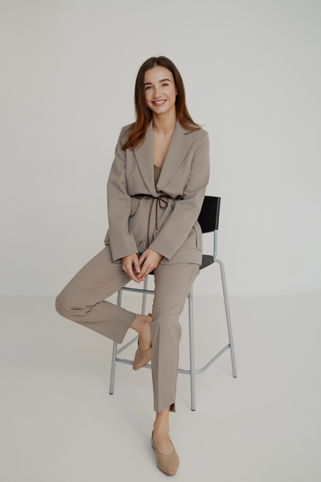 Elegant Girl Sitting on a Stool